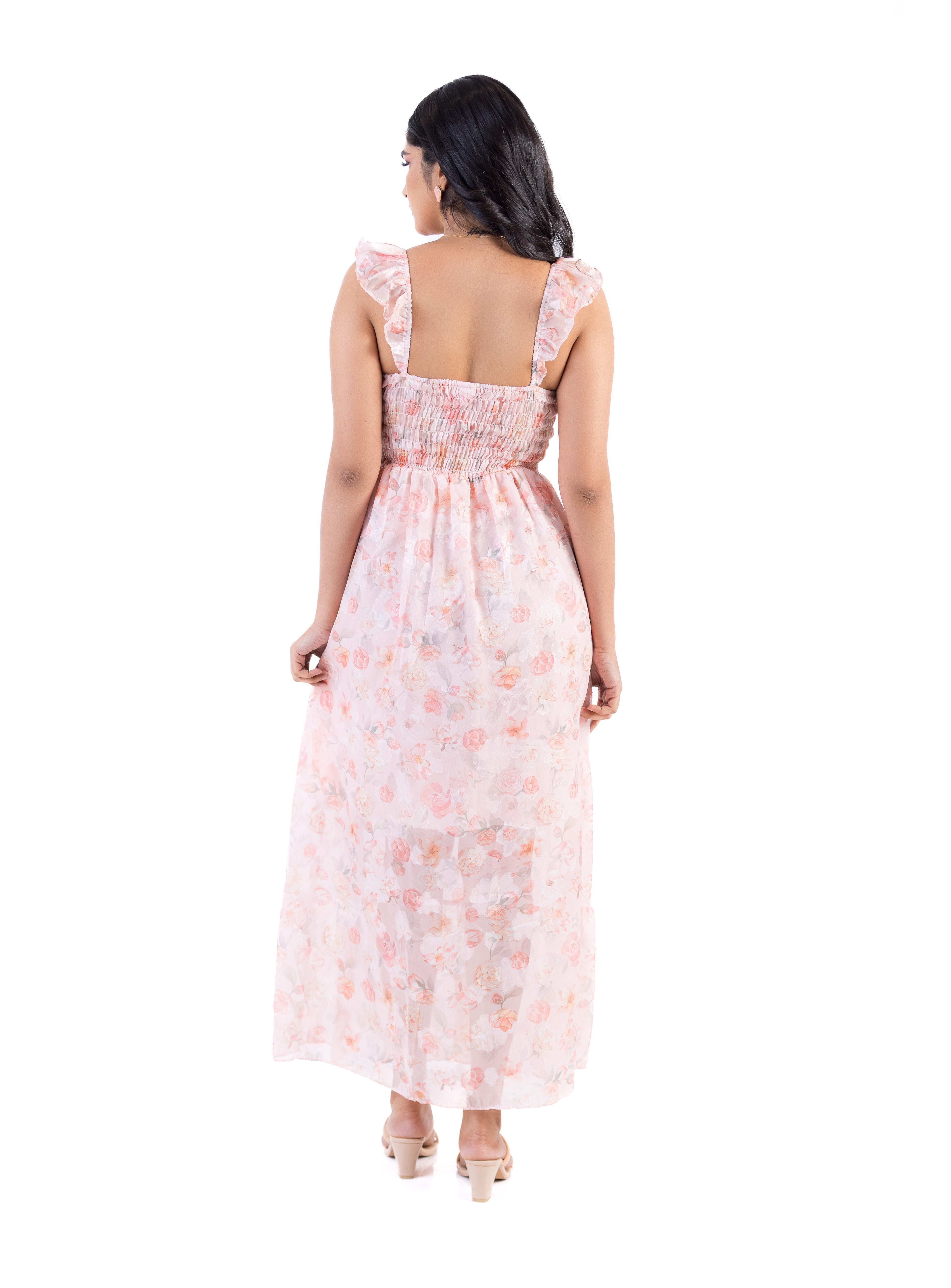 Back view of the Floral Breeze Midi Dress in pink featuring a feminine floral pattern and elegant midi length design